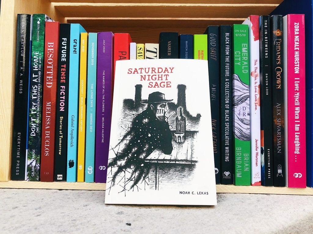 This is an independent book review original photo of saturday night sage by Noah C. Lekas in front of a bunch of small press books.